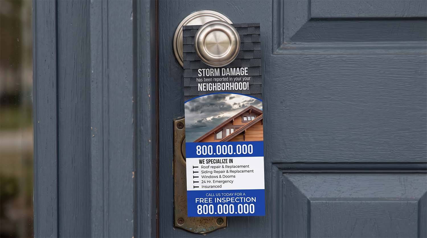 Roofing door hangers placed on a residential door handle with a newly repaired roof in the background