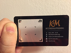 black camera lens plastic business card front